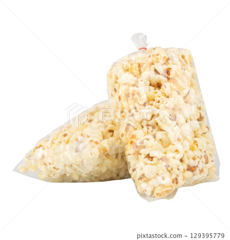 Popcorn in a Plastic Bag Tied with a Rubber Band on White Background 129395779