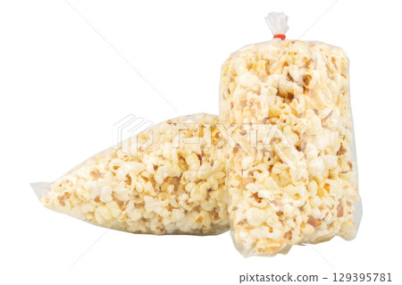 Popcorn in a Plastic Bag Tied with a Rubber Band on White Background 129395781