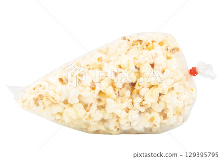 Popcorn in a Plastic Bag Tied with a Rubber Band on White Background 129395795