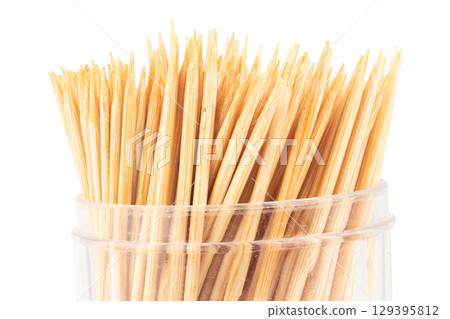 Toothpicks in a Clear Plastic Bottle on White Background 129395812