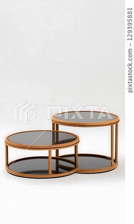 Two round tables made of wood and glass 129395881