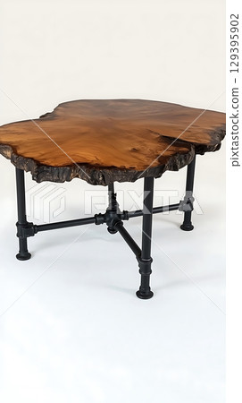 A wooden table with a black metal frame 129395902