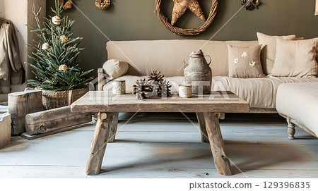 Living room with a wooden coffee table and a Christmas tree 129396835