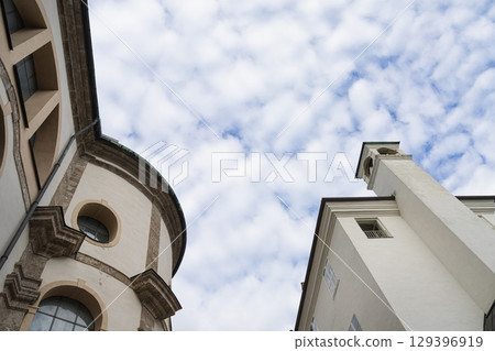 a view upwards between the old buildings in Innsbruck, Austria 129396919