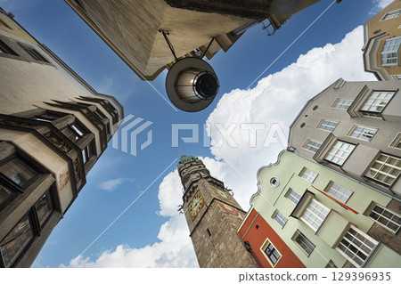 a view upwards between the old buildings in Innsbruck, Austria 129396935