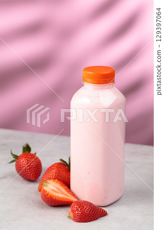 Strawberry milkshake smoothie in eco disposable jar and fresh berries. 129397064