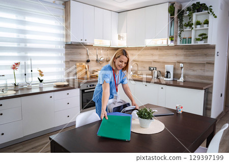 Female Doctor Preparing for Work in Her Modern Kitchen Female Doctor Preparing for Work in Her Modern Kitchen 129397199