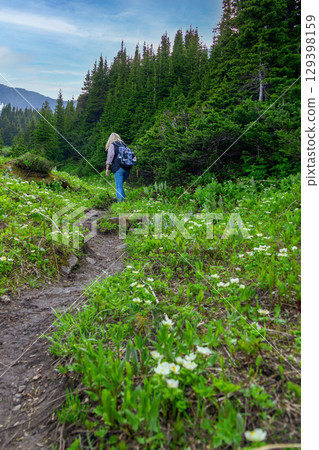Female Hiker on Mountain Trail in Spring 129398159