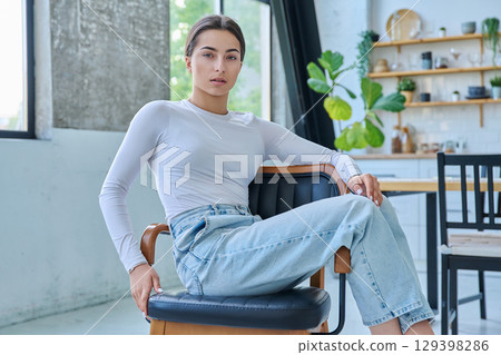 Portrait of beautiful stylish young teenage girl posing at home 129398286