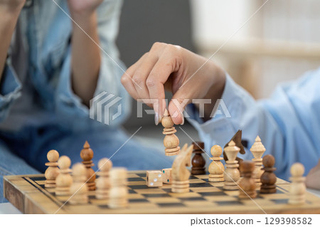 Close-Up of Chess Move Strategic Gameplay at Home 129398582