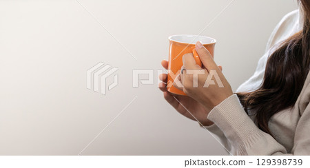 Mindfulness Moment: Woman Enjoying Tea and Relaxation 129398739