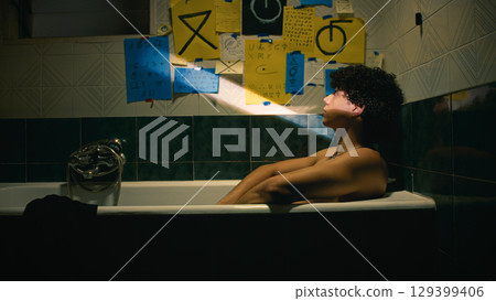 Man Taking And Reading The Notes From The Wall  129399406