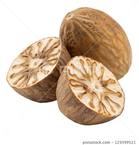 Whole and halved fresh nutmeg with seed visible, aromatic spice isolated on transparent background 129399521