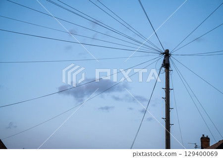 Electricity Pole and electricity cable, evening blue sky  129400069