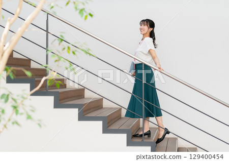 Young business woman working in the office Young business woman working in the office 129400454