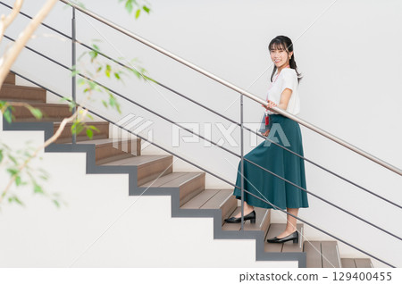 Young business woman working in the office 129400455