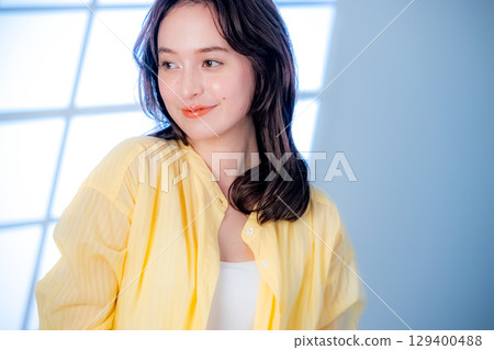 A young woman looking at the camera A young woman looking at the camera 129400488