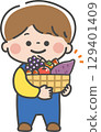 A boy holding a basket full of autumn delicacies A boy holding a basket full of autumn delicacies 129401409
