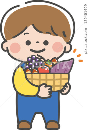 A boy holding a basket full of autumn delicacies 129401409