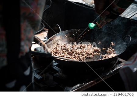 Rice topped with stir-fried pork or beef and basil Rice topped with stir-fried pork or beef and basil 129401706