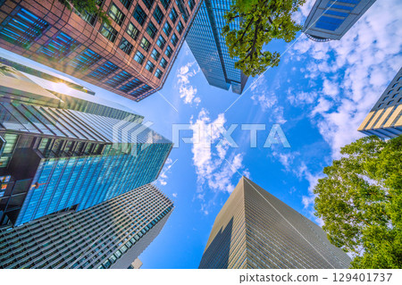 A sudden thunderstorm passes through the Tokyo cityscape in Japan... Otemachi business district. View of buildings such as Otemachi Place = August 8th 129401737