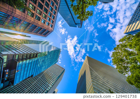 A sudden thunderstorm passes through the Tokyo cityscape in Japan... Otemachi business district. View of buildings such as Otemachi Place = August 8th 129401738