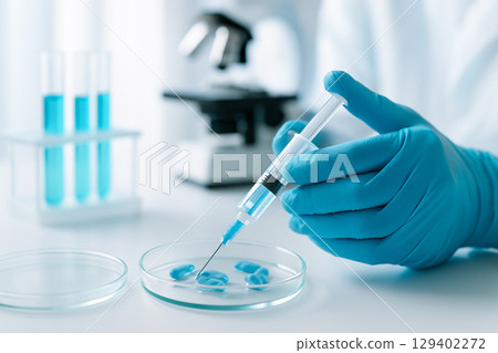 AI generated gloved hands handling syringe with capsule in petri dish showing precision research in biotechnology with sterile lab tools and blue clean environment 129402272