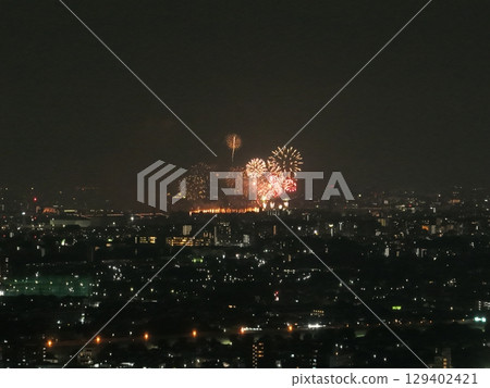 Fireworks in Itabashi and Toda illuminating the summer night sky (taken from a high vantage point equivalent to the rooftop of a tower apartment building in Nerima, Tokyo) Fireworks in Itabashi and Toda illuminating the summer night sky (taken from a high vantage point equivalent to the rooftop of a tower apartment building in Nerima, Tokyo) 129402421