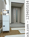 Delivery box installed at the entrance of a house 129405034