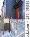 Delivery box installed at the entrance of a house 129405036