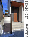Delivery box installed at the entrance of a house 129405038