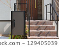 Delivery box installed at the entrance of a house 129405039