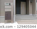 Delivery box installed at the entrance of a house 129405044
