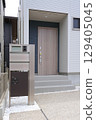 Delivery box installed at the entrance of a house 129405045