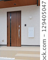Delivery box installed at the entrance of a house 129405047
