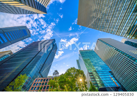 A sudden thunderstorm passes through the Tokyo cityscape in Japan... Otemachi business district. View of buildings such as Otemachi Place = August 8th 129405830