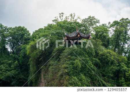 Exploring ancient architecture amidst lush green nature in DuJianYan 129405837