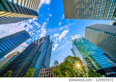 A sudden thunderstorm passes through the Tokyo cityscape in Japan... Otemachi business district. View of buildings such as Otemachi Place = August 8th 129405971