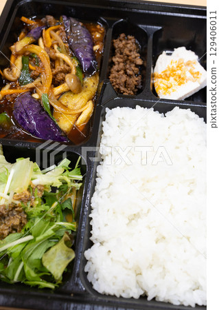 Delicious spicy stir-fried eggplant and minced meat Chinese lunch box Delicious spicy stir-fried eggplant and minced meat Chinese lunch box 129406011