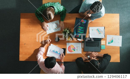 Time lapse of business people working together to analyze chart. Convocation. Time lapse of business people working together to analyze chart. Convocation. 129406117