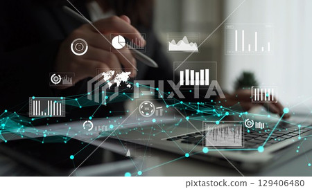 Business Professional Analyzing Data Trends with Digital Graphics and Charts on a Laptop in a Modern Office Environment xenic Business Professional Analyzing Data Trends with Digital Graphics and Charts on a Laptop in a Modern Office Environment xenic 129406480