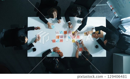 Top view of business people writing marketing idea at sticky notes. Directorate. Top view of business people writing marketing idea at sticky notes. Directorate. 129406481