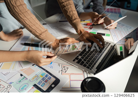 Creative UX UI Design Process with Team Collaborating on Mobile App Interface Prototypes and Wireframes Creative UX UI Design Process with Team Collaborating on Mobile App Interface Prototypes and Wireframes 129406625