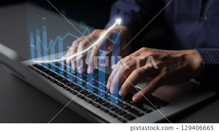 Professional Hands Typing on Laptop with Digital Data Visualization and Graphs, Representing Financial Growth and Business Analysis Concept Copula 129406665