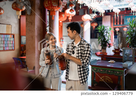 Travel adventure exploring a vibrant asian tea house local culture casual dining indoor setting engaging experience 129406779
