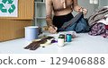 Recycling clothes creative upcycling ideas home workspace diy content organized environment close-up view sustainable fashion 129406888