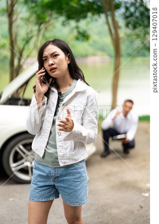 Insurance Claim. Frustrated woman on phone discussing vehicle issues with an agent. Insurance Claim. Frustrated woman on phone discussing vehicle issues with an agent. 129407018