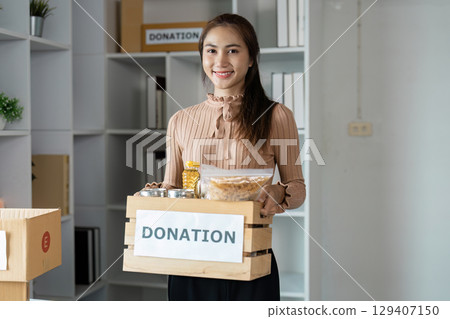 volunteer Assisting at Donation Centers and Food Banks Providing Essential Support to Communities in Need volunteer Assisting at Donation Centers and Food Banks Providing Essential Support to Communities in Need 129407150