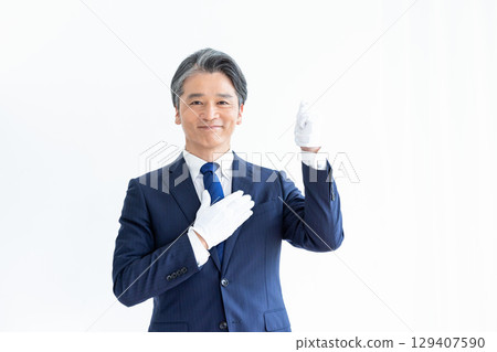 Buyer appraiser, man wearing white gloves and holding a calculator 129407590