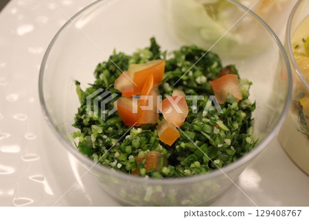 Lebanese meze (appetizer) and tabbouleh (chopped parsley salad) at a restaurant in Doha, Qatar 129408767